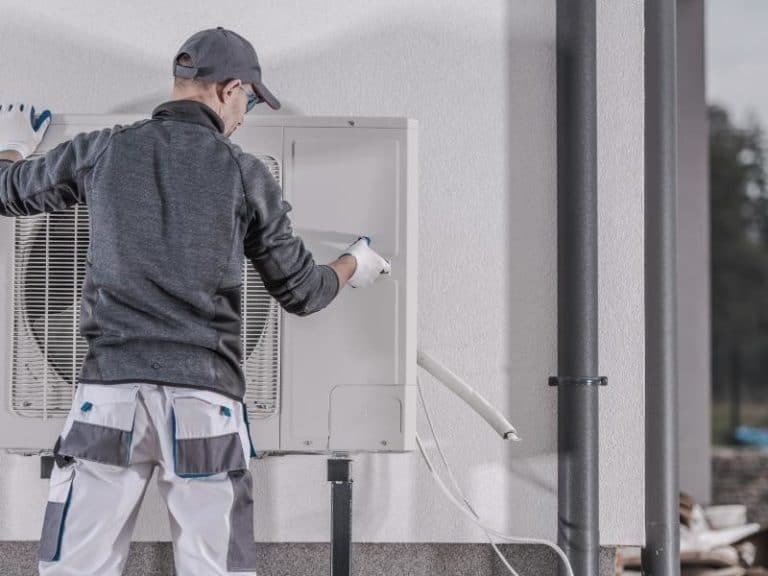 Man installing a heat pump