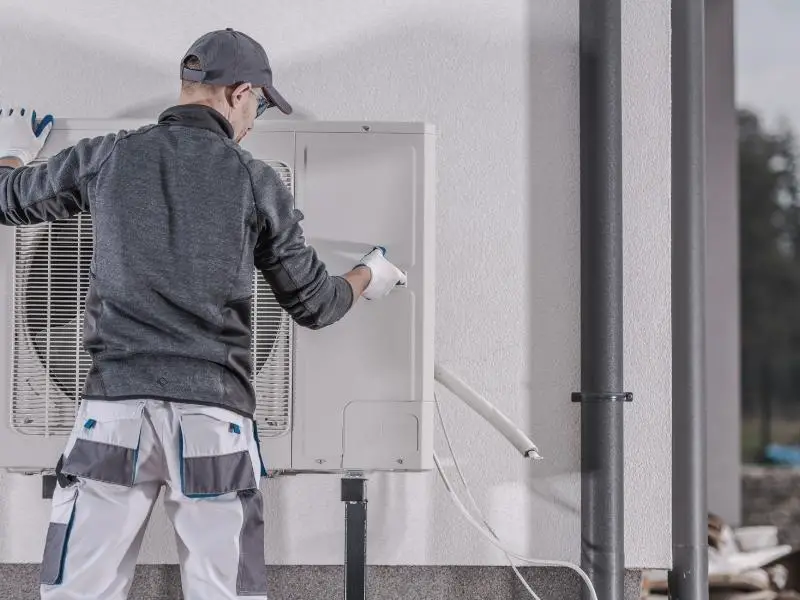 Man installing a heat pump