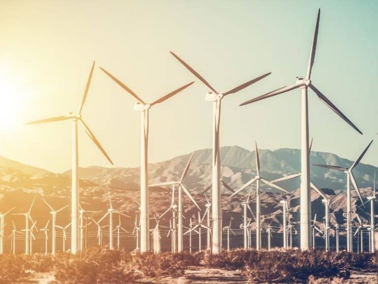Wind turbine farm in front of hills