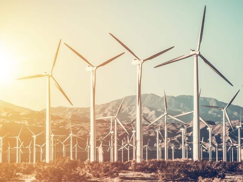 Wind turbine farm in front of hills